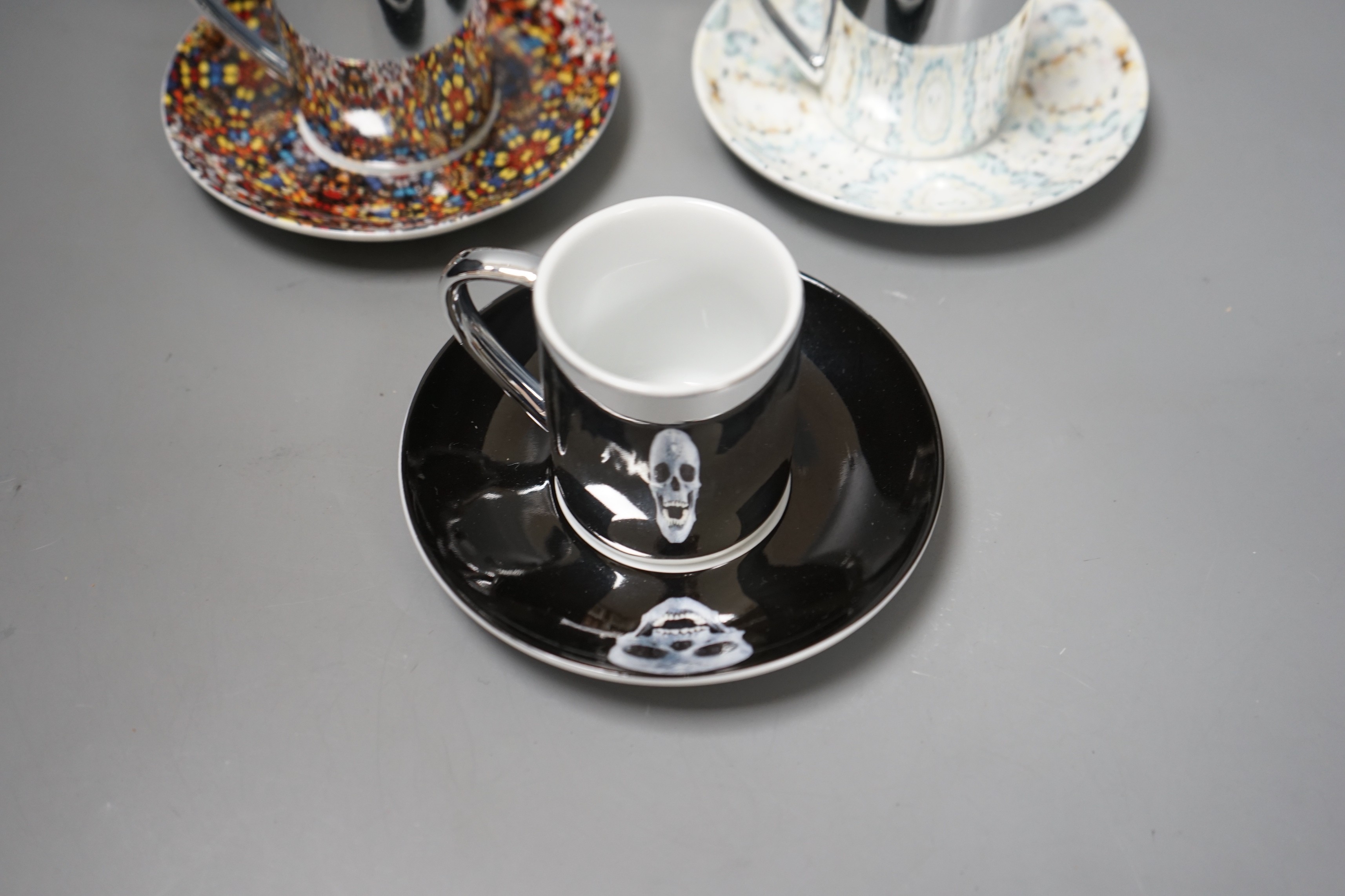 Damian Hirst, a set of six espresso cups and saucers; ‘Doorways to the Kingdom of Heaven’ 2007, ‘For the Love of God’ 2007, ‘The Incomplete Truth’ 2006, ‘Beautiful, cataclysmic pink minty shifting horizon exploding star